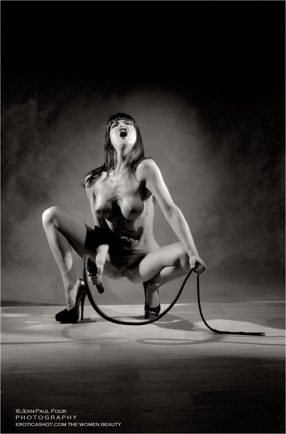 Louva, hot brunette, fetish woman, hot model, latex, vynil dress, tatoos, piercings follow her on eroticashot.com, pict by Jean-Paul Four